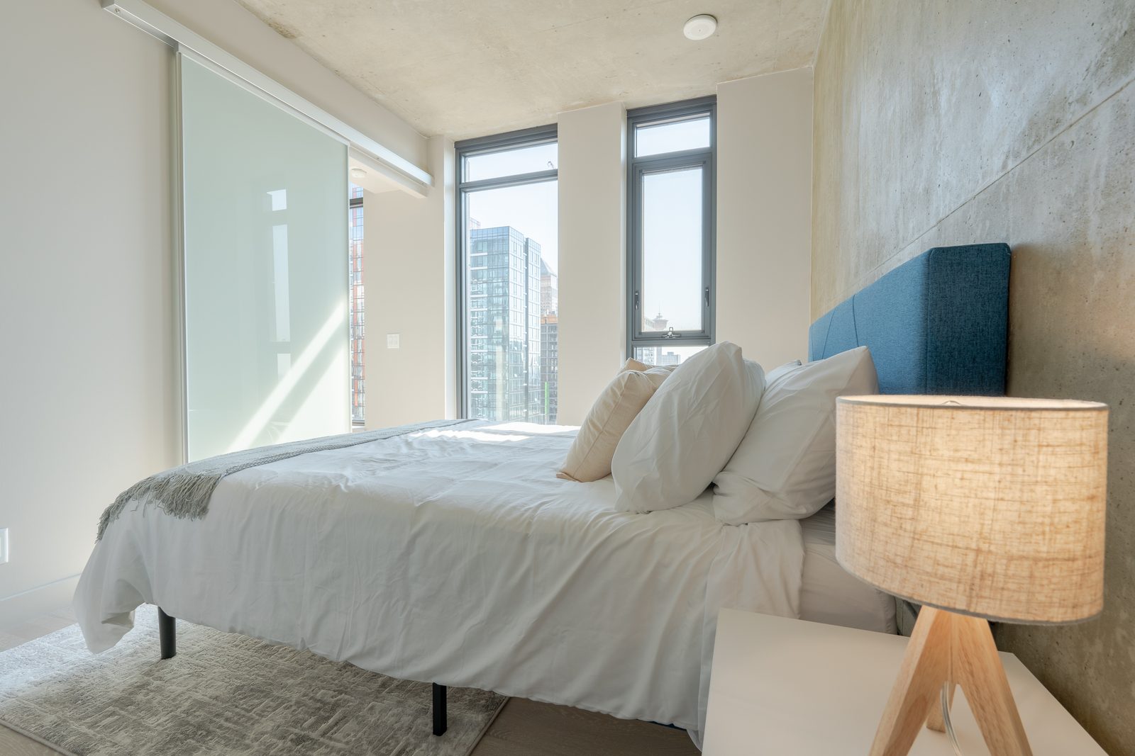 Bright furnished Calgary bedroom in a mid-term rental managed by District One